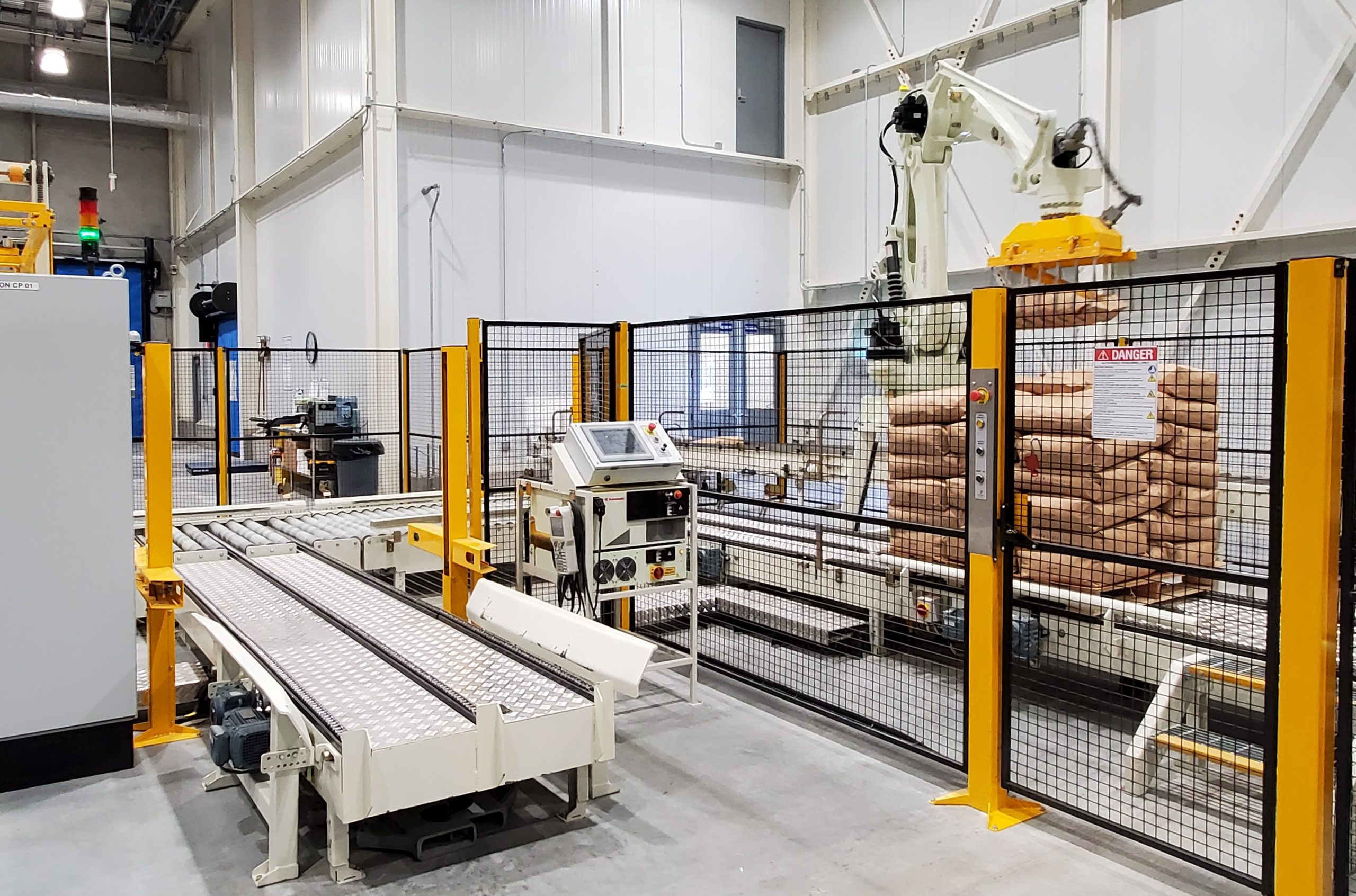 Robotic palletizer stacking cases onto pallets